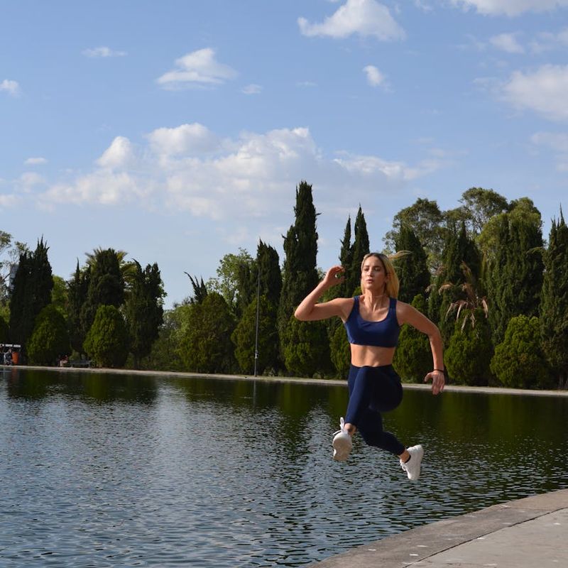 Person mid-jump during a cardio exercise, showing energy and motion.