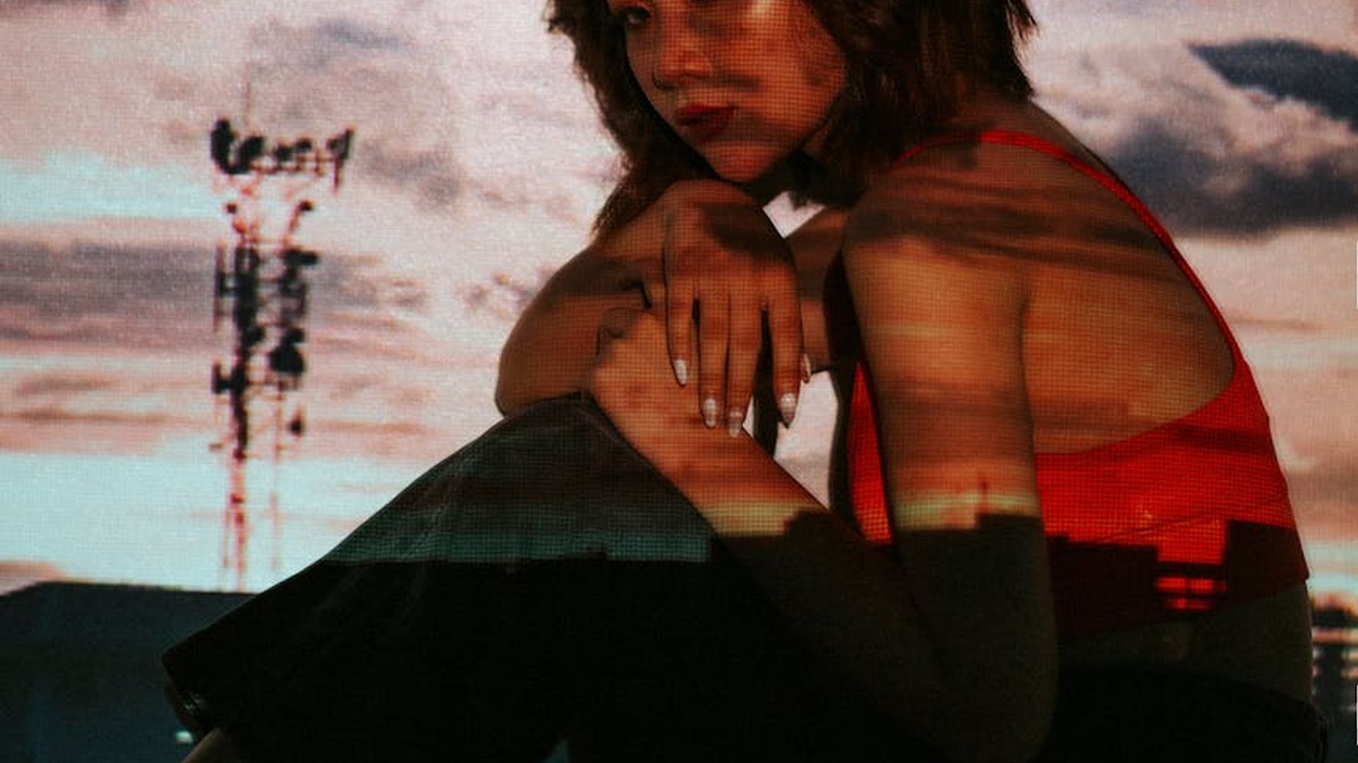 Silhouette of a person in a dynamic cardio pose against a dark, atmospheric background.